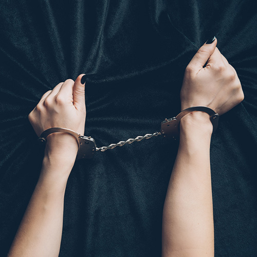 woman's hands with sexy handcuffs