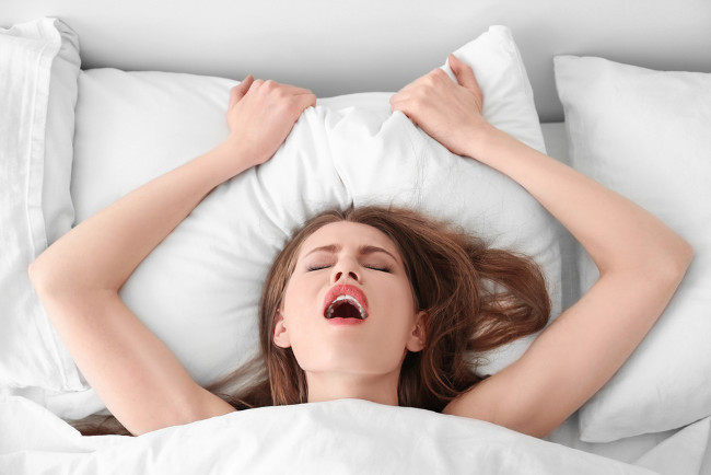 image of a woman's expression when having an orgasm