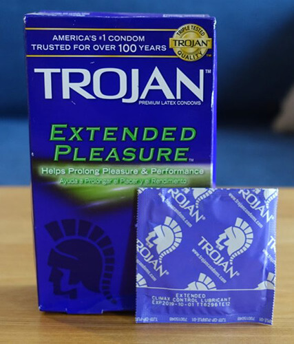 photo of one trojan extended pleasure delay condom and a standard box